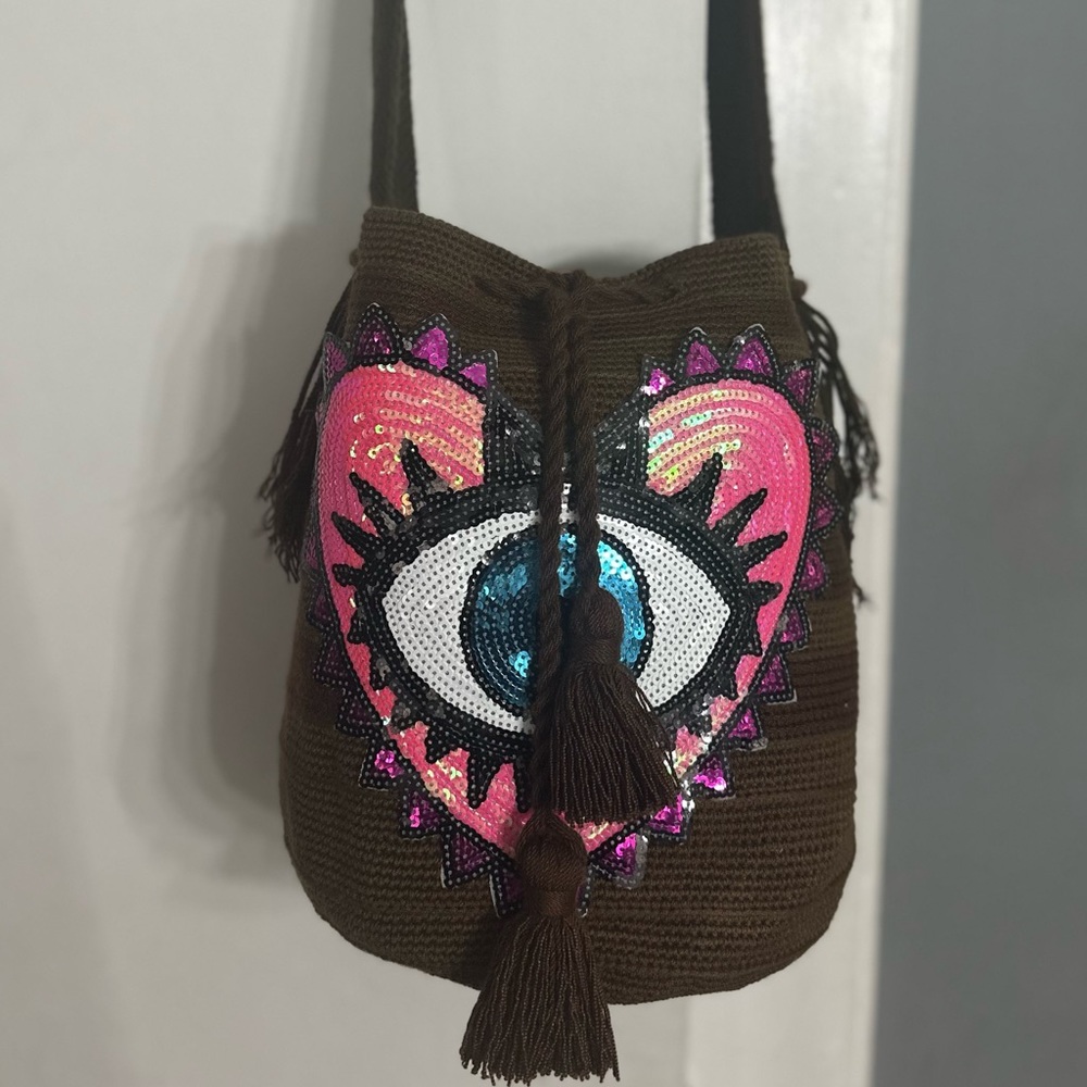 Hand made crochet crossbody bag with evil eye appliqués.  Wayuu style